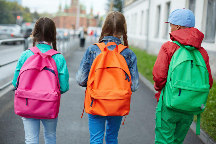 toddler wearing backpack